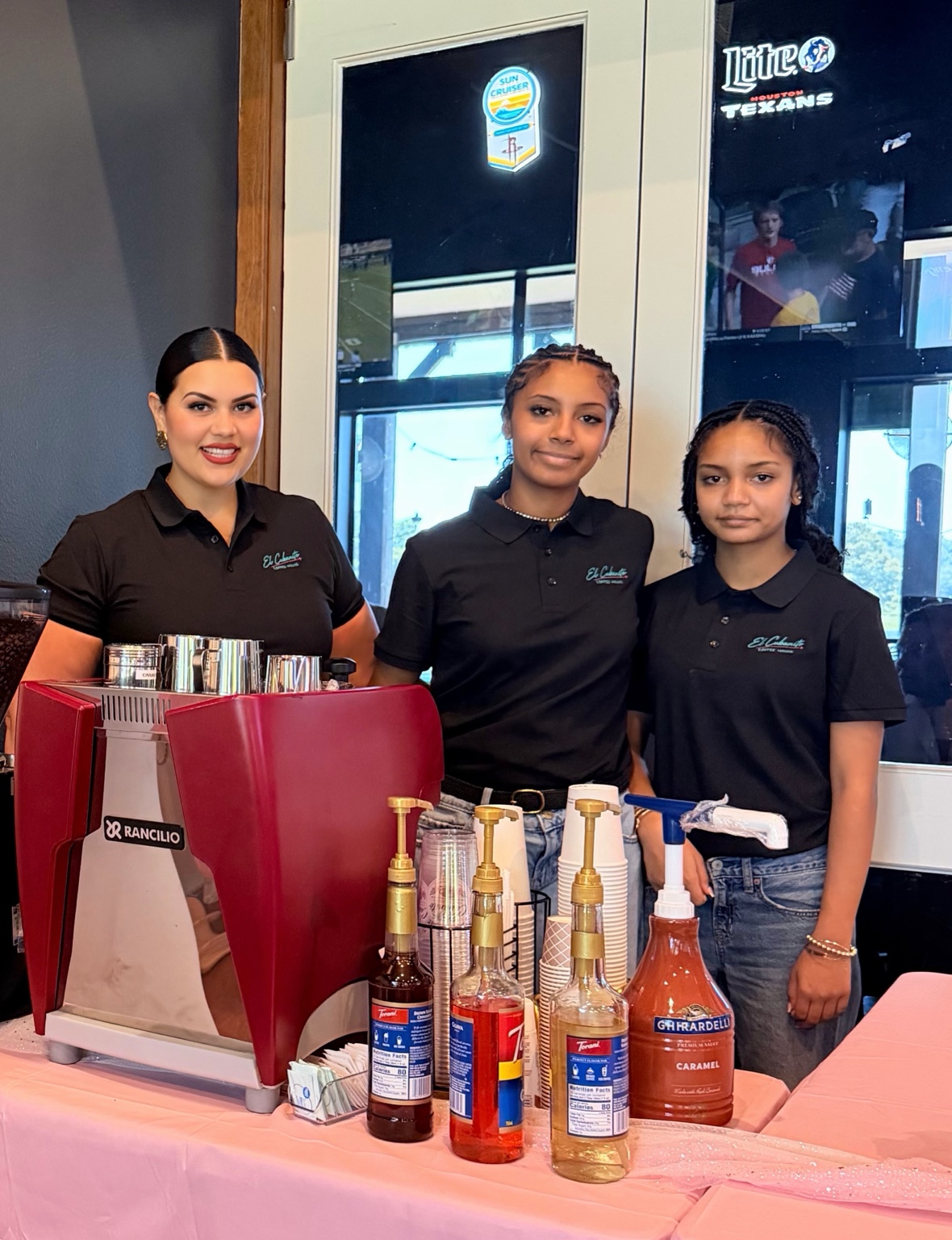 The El Cubanito family working side by side behind their espresso machine