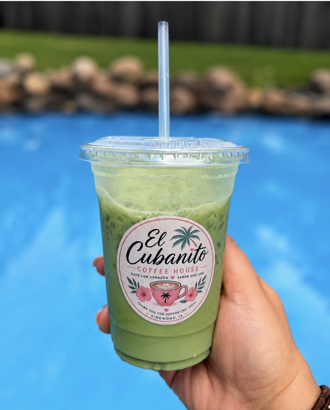 A green iced matcha latte with the El Cubanito logo